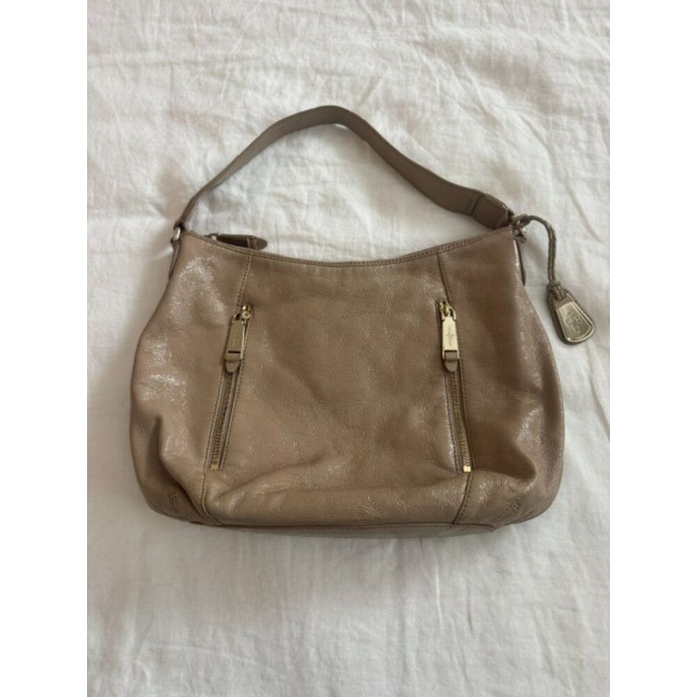 Cole Haan tan patent leather hobo shoulder bag.